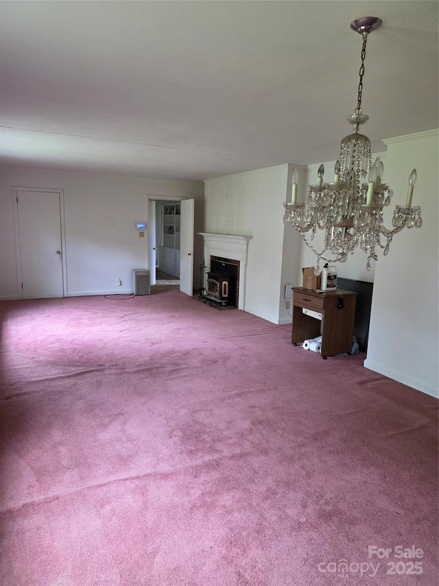 4298 NC-41 Hwy S, Fairmont, NC 28340 - unfurnished living room featuring a fireplace, a chandelier, carpet flooring, and baseboards
