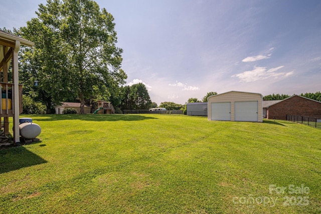 233 Reliance Rd, Kings Mountain, NC 28086 - view of yard featuring a playground, a detached garage, and an outdoor structure