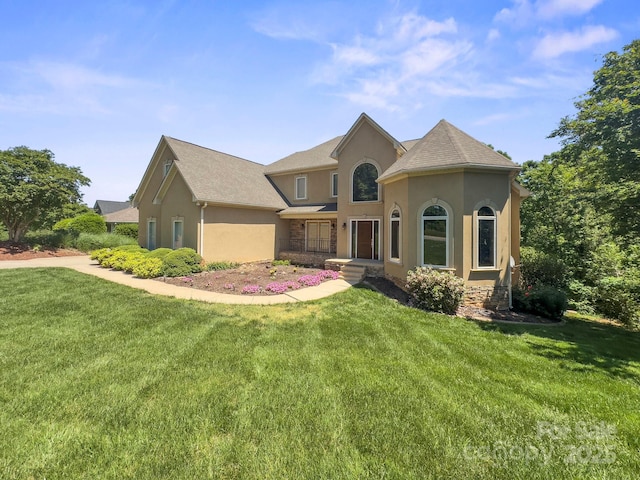 122 Long Cove Ln, Mooresville, NC 28117 - view of front facade with stucco siding and a front yard