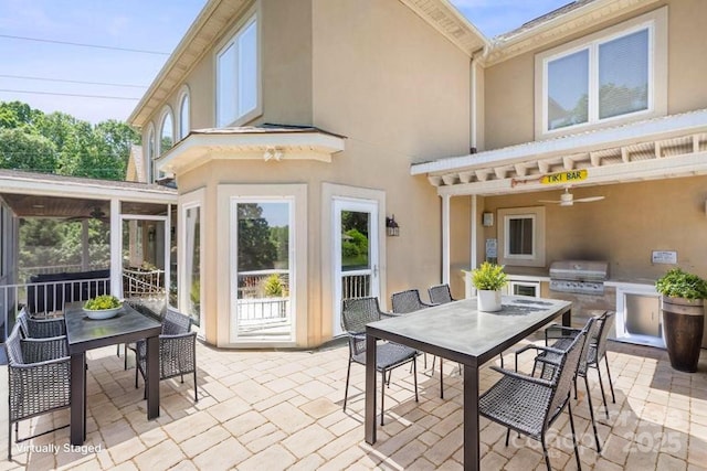 122 Long Cove Ln, Mooresville, NC 28117 - view of patio / terrace with outdoor dining space, a ceiling fan, and a sunroom