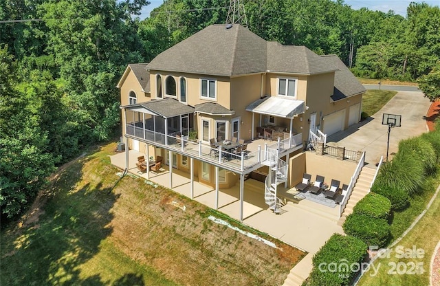 122 Long Cove Ln, Mooresville, NC 28117 - back of house featuring stucco siding, stairs, a shingled roof, a patio area, and concrete driveway