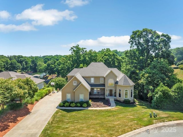 122 Long Cove Ln, Mooresville, NC 28117 - traditional-style home with stucco siding, concrete driveway, and a front yard