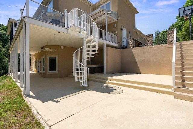 122 Long Cove Ln, Mooresville, NC 28117 - rear view of property with stairs, stucco siding, ceiling fan, and a patio area
