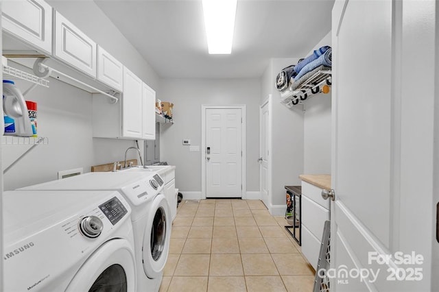 122 Long Cove Ln, Mooresville, NC 28117 - laundry room with independent washer and dryer, cabinet space, light tile patterned flooring, and baseboards