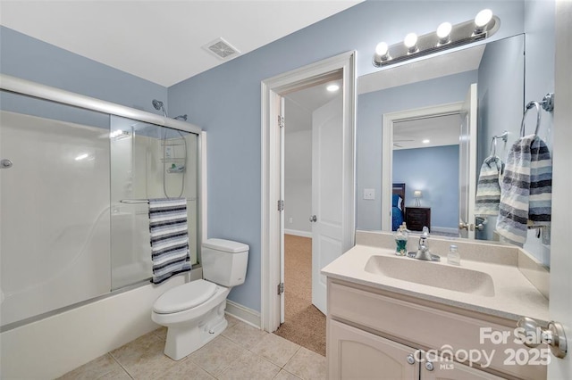 122 Long Cove Ln, Mooresville, NC 28117 - ensuite bathroom featuring toilet, vanity, tile patterned floors, shower / bath combination with glass door, and baseboards