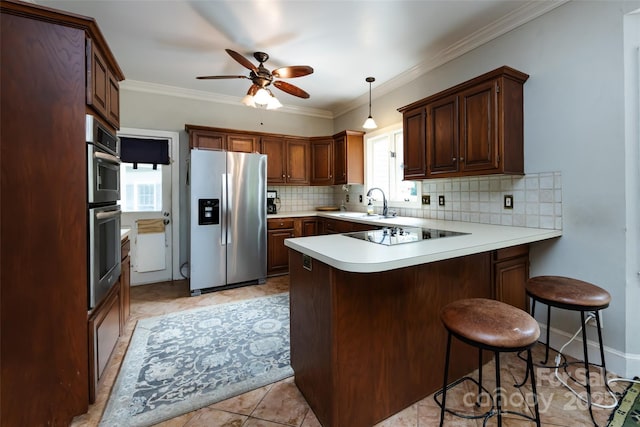 6511 Buggy Whip Ln, Waxhaw, NC 28173 - kitchen featuring appliances with stainless steel finishes, a peninsula, decorative backsplash, a ceiling fan, and light countertops