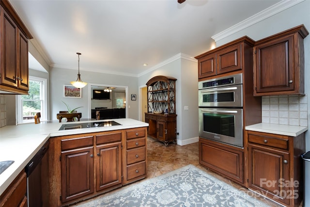 6511 Buggy Whip Ln, Waxhaw, NC 28173 - kitchen with stainless steel appliances, tasteful backsplash, ornamental molding, light countertops, and a peninsula