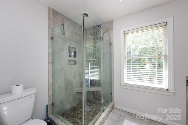 6511 Buggy Whip Ln, Waxhaw, NC 28173 - bathroom featuring a stall shower and plenty of natural light