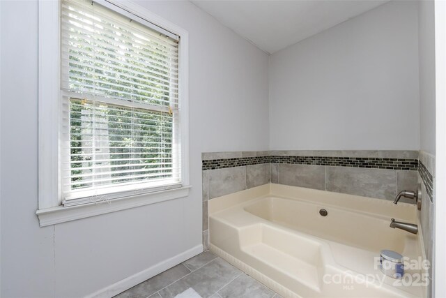 6511 Buggy Whip Ln, Waxhaw, NC 28173 - bathroom featuring a bath and tile patterned flooring