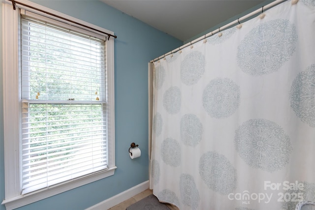 6511 Buggy Whip Ln, Waxhaw, NC 28173 - bathroom with baseboards and curtained shower