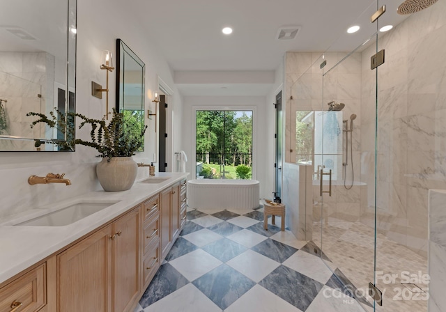 15037 June Washam Rd, Davidson, NC 28036 - bathroom with a shower stall, double vanity, recessed lighting, a freestanding tub, and tile patterned flooring