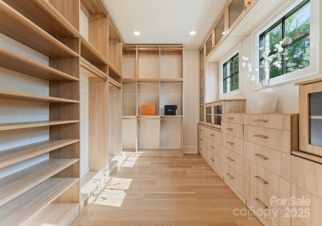 15037 June Washam Rd, Davidson, NC 28036 - walk in closet with light wood finished floors