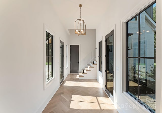 15037 June Washam Rd, Davidson, NC 28036 - corridor with a chandelier, stairs, and french doors