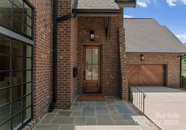 2921 Windsor Ave, Charlotte, NC 28209 - property entrance featuring brick siding, driveway, and a shingled roof
