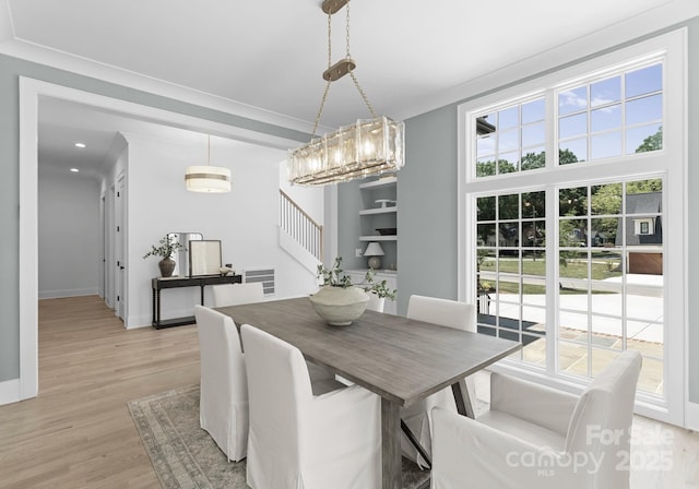 2921 Windsor Ave, Charlotte, NC 28209 - dining space with light wood-style flooring and stairs