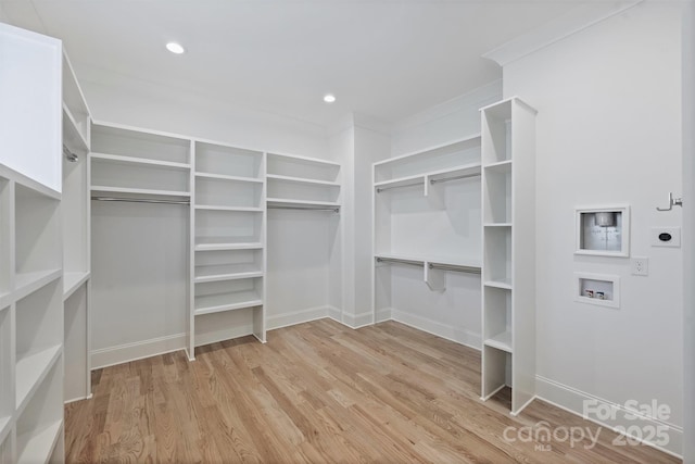 2921 Windsor Ave, Charlotte, NC 28209 - walk in closet with light wood finished floors