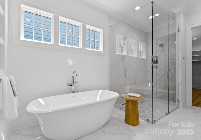 2921 Windsor Ave, Charlotte, NC 28209 - full bath with marble finish flooring, a freestanding bath, a marble finish shower, and recessed lighting