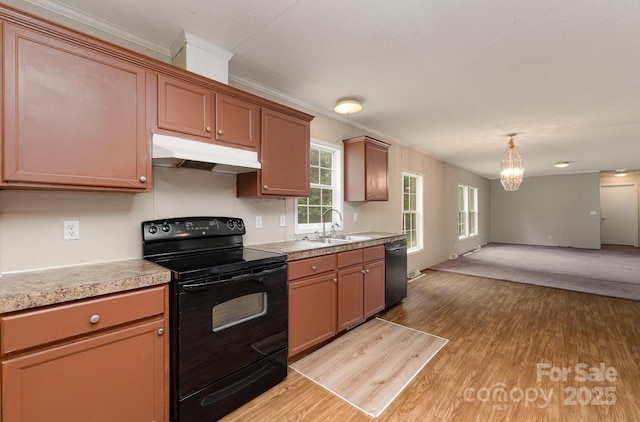 828 Carver St Unit 17-19, Shelby, NC 28152 - kitchen featuring black appliances, under cabinet range hood, a chandelier, light countertops, and ornamental molding