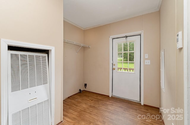 828 Carver St Unit 17-19, Shelby, NC 28152 - laundry room with a heating unit, crown molding, and light wood finished floors
