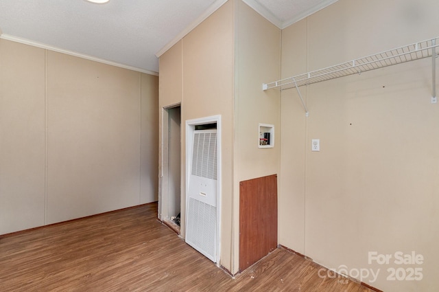 828 Carver St Unit 17-19, Shelby, NC 28152 - washroom featuring a heating unit, ornamental molding, wood finished floors, and hookup for a washing machine