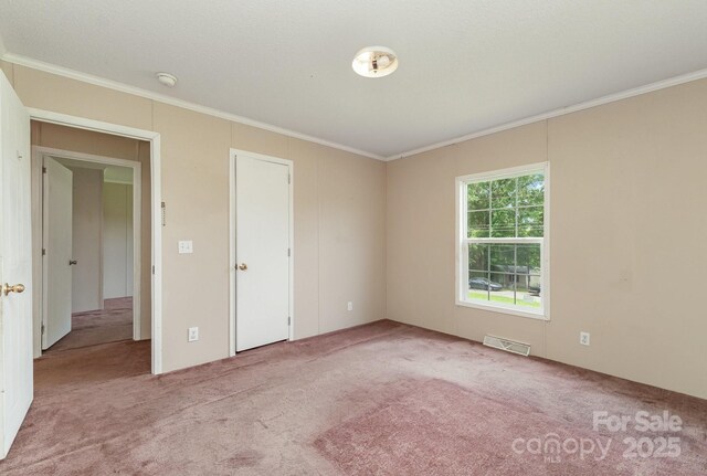 828 Carver St Unit 17-19, Shelby, NC 28152 - unfurnished bedroom featuring carpet flooring and crown molding
