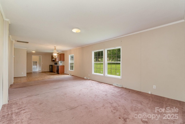 828 Carver St Unit 17-19, Shelby, NC 28152 - unfurnished living room with crown molding and light colored carpet