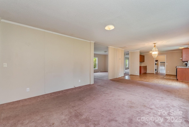 828 Carver St Unit 17-19, Shelby, NC 28152 - unfurnished living room featuring light carpet, crown molding, a chandelier, and a textured ceiling
