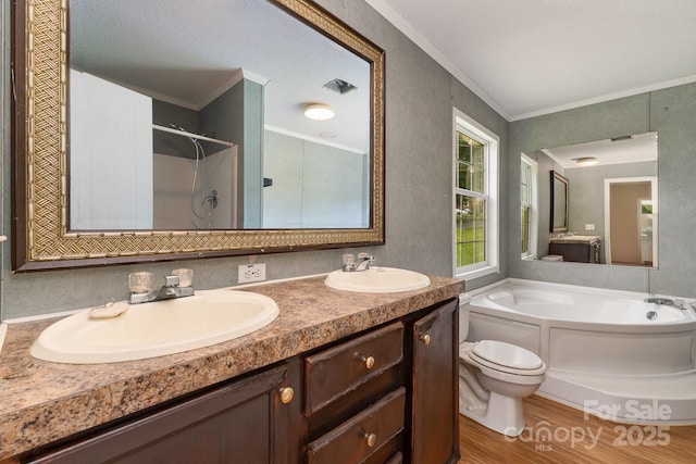 828 Carver St Unit 17-19, Shelby, NC 28152 - bathroom featuring a bath, crown molding, double vanity, a shower, and wood finished floors