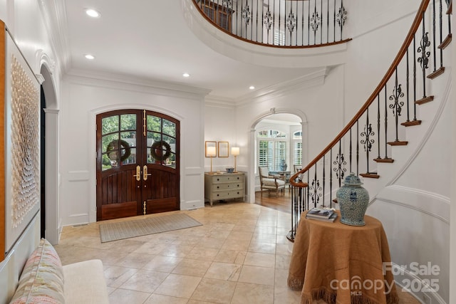 2954 Reynolds Sq, Winston Salem, NC 27106 - foyer featuring arched walkways, ornamental molding, french doors, stairway, and recessed lighting