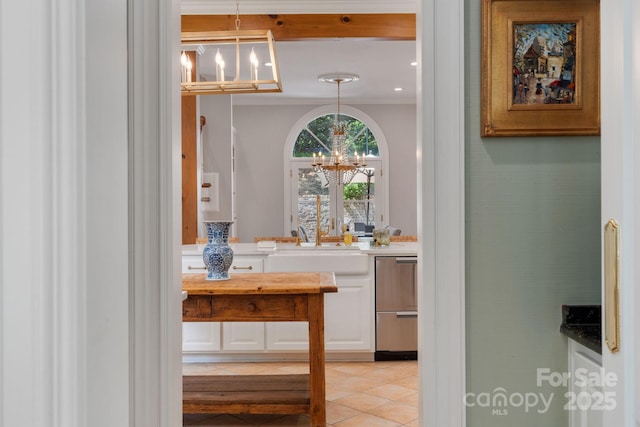 2954 Reynolds Sq, Winston Salem, NC 27106 - kitchen featuring a chandelier, stainless steel dishwasher, a sink, crown molding, and white cabinetry