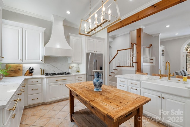2954 Reynolds Sq, Winston Salem, NC 27106 - kitchen featuring high end fridge, a sink, premium range hood, tasteful backsplash, and ornamental molding