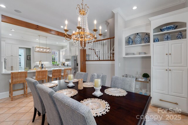 2954 Reynolds Sq, Winston Salem, NC 27106 - dining space featuring light tile patterned floors, a chandelier, recessed lighting, ornamental molding, and baseboards