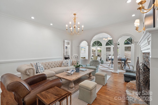 2954 Reynolds Sq, Winston Salem, NC 27106 - living room with a chandelier, ornate columns, ornamental molding, recessed lighting, and light wood-style flooring