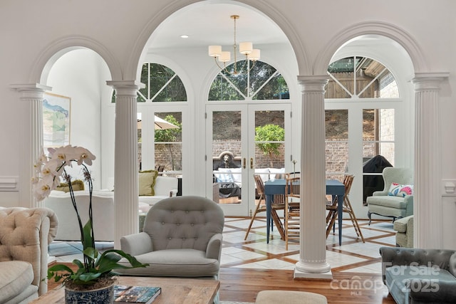 2954 Reynolds Sq, Winston Salem, NC 27106 - living room with ornate columns, arched walkways, healthy amount of natural light, french doors, and a high ceiling