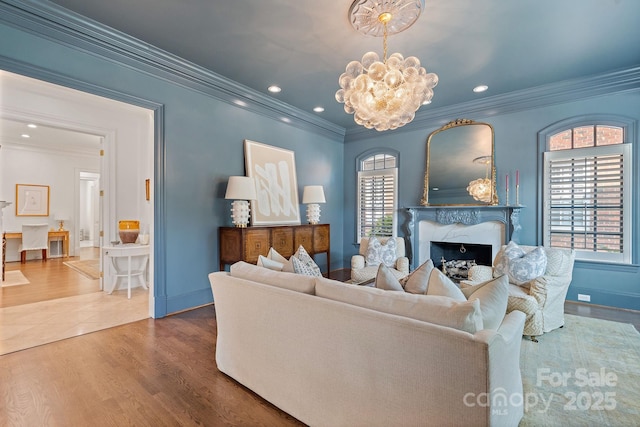 2954 Reynolds Sq, Winston Salem, NC 27106 - living area with a chandelier, a fireplace, crown molding, wood finished floors, and baseboards