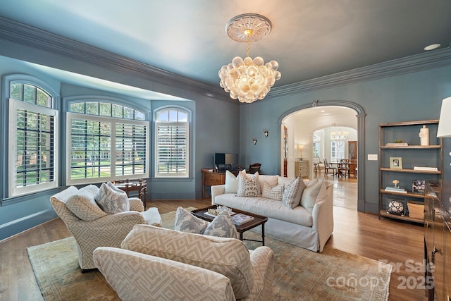 2954 Reynolds Sq, Winston Salem, NC 27106 - living room with a chandelier, arched walkways, ornamental molding, wood finished floors, and baseboards