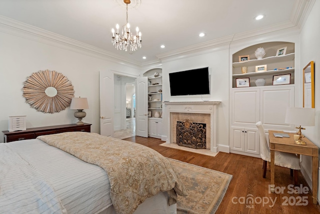 2954 Reynolds Sq, Winston Salem, NC 27106 - bedroom with a fireplace, ornamental molding, wood finished floors, a chandelier, and recessed lighting