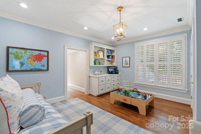2954 Reynolds Sq, Winston Salem, NC 27106 - living room featuring light wood finished floors, ornamental molding, a chandelier, baseboards, and recessed lighting