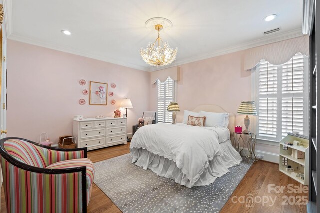 2954 Reynolds Sq, Winston Salem, NC 27106 - bedroom featuring multiple windows, a chandelier, wood finished floors, crown molding, and recessed lighting