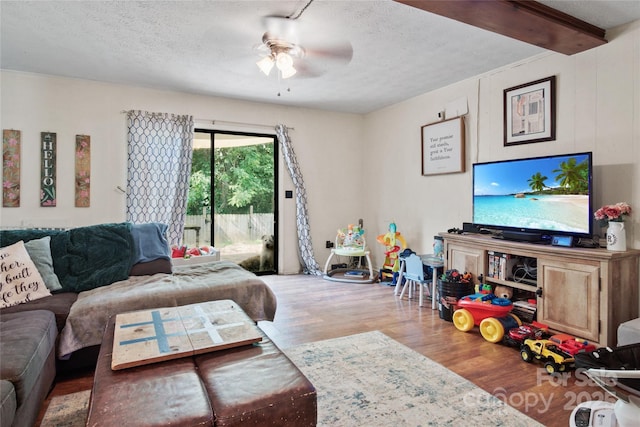 46 Westbrook Cir, Clyde, NC 28721 - living area with wood finished floors, a ceiling fan, and a textured ceiling