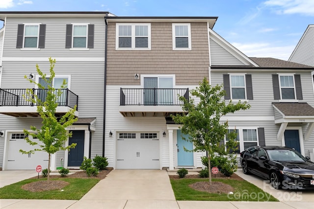 15034 Scoter St, Charlotte, NC 28262 - view of property with a garage, driveway, and a balcony