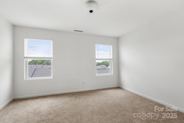 15034 Scoter St, Charlotte, NC 28262 - spare room featuring plenty of natural light, carpet flooring, and baseboards