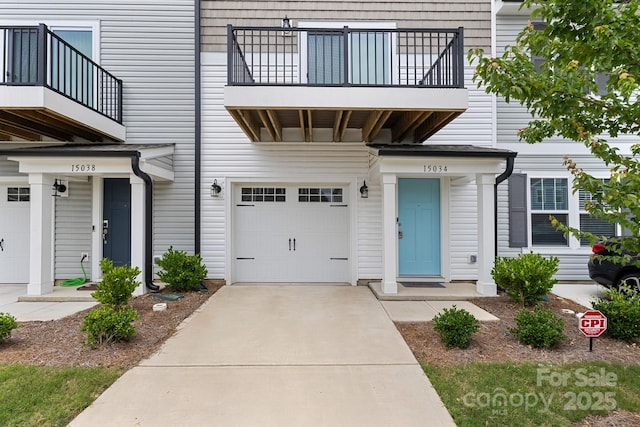 15034 Scoter St, Charlotte, NC 28262 - view of front of property with a balcony, an attached garage, and driveway