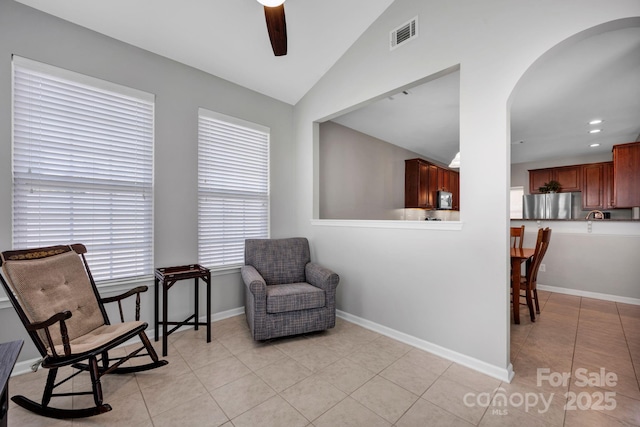 3351 Streamside Dr, Davidson, NC 28036 - living area with light tile patterned floors, a ceiling fan, arched walkways, lofted ceiling, and recessed lighting
