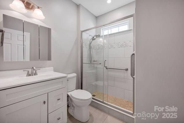 3351 Streamside Dr, Davidson, NC 28036 - full bathroom featuring a stall shower, vanity, and tile patterned flooring