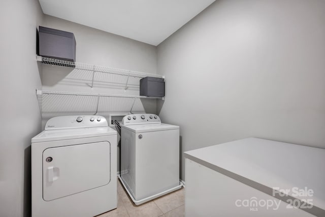 3351 Streamside Dr, Davidson, NC 28036 - washroom featuring washer and clothes dryer and light tile patterned floors