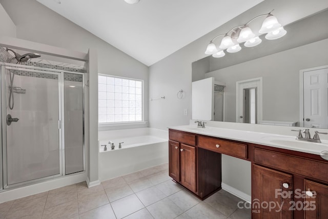 3351 Streamside Dr, Davidson, NC 28036 - full bath with vaulted ceiling, a garden tub, a stall shower, double vanity, and tile patterned floors