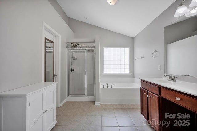 3351 Streamside Dr, Davidson, NC 28036 - full bathroom with vanity, a shower stall, lofted ceiling, a bath, and tile patterned flooring