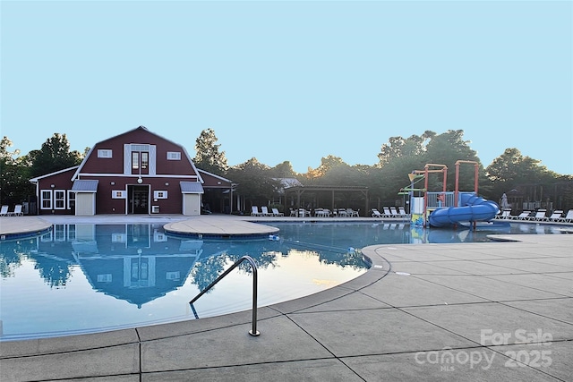 3351 Streamside Dr, Davidson, NC 28036 - community pool with a water slide and a barn