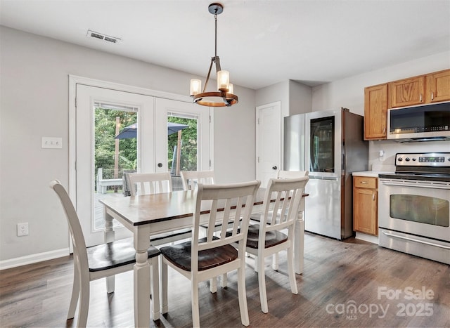 1003 Snake River Ct, Monroe, NC 28110 - dining area with wood finished floors, a chandelier, and french doors